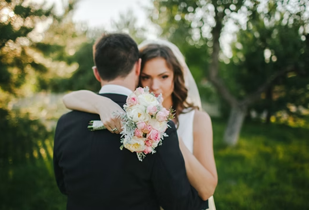 Couple posing for wedding portrait in nature